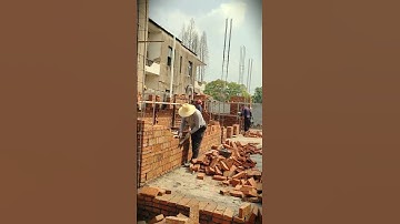 The smart way workers build buildings with stacked red bricks #shorts