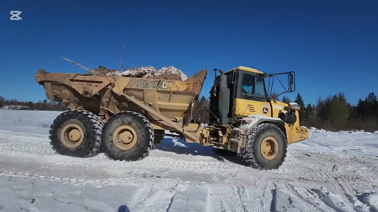 300 john deere excavator and john deere rock truck moving alot of the dirt