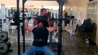 Tom Beaton 235 with chains on shoulder press.