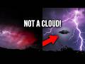 Disc shaped ufo gets hit by lightning as is hovering near enough to be spotted
