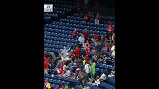 Man 👨 catches a foul ball ⚾ in one hand ✋and having a child in another hand | baseball match|shorts|