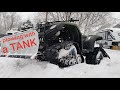 ATV with TRACKS plowing snow