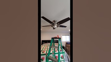 Balancing a new ceiling fan during installation. #shorts