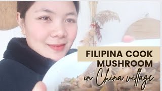 Filipina cooks mushrooms in China village.A peaceful and amazing lifestyle in China village.