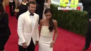 David Beckham greets Police officers arriving with Victoria Beckham at 2014 Met Gala