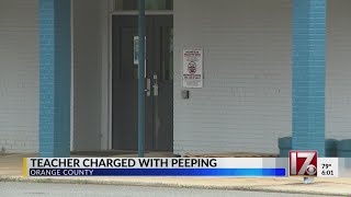 Teacher charged with peeping in Orange County