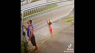 Girl Hangs Off Garage Door