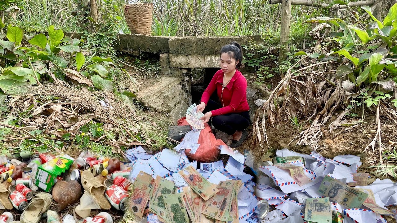 Lucky trash girl earns money from envelopes and bags of money in scrap pile