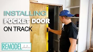 Installing a Pocket Door on the Track | Remodelaholic  #diy #doors #doorframe