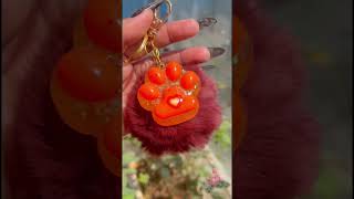 Handmade resin paw keychains, they all glow in the dark