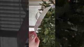 Adding ribbon to a Christmas tree #ribbon #christmastree #christmastreedecoration #diycrafts