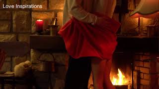 Couple making Love in front of Fire. Romance. Kissing. Passionate Love