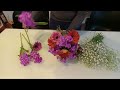 Creating a spring flowers bouquet red  pink gerberas hot pink dahlias and gypso