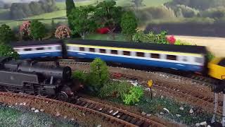 Class 37 pulling MK3 blue/grey coaches with 1st class and buffet hurtling over a viaduct DCC sound
