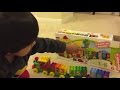 Kid playing with toys Lego Duplo Number Train
