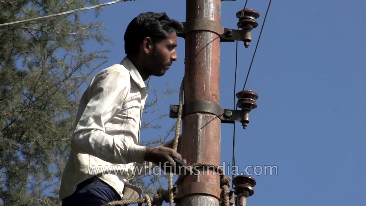 removing wires from electric post to install heavy duty cables in