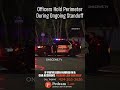 Officers Hold Perimeter During Ongoing Standoff