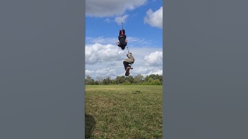 Henry Cabelus flips over Nic Patino on a pogo stick while Nic does a flip on a pogo stick