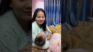 BREASTFEEDING BABY BY BEAUTIFUL MOTHER.