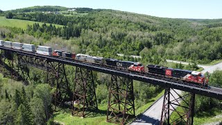 Awesome Aerial View in 4K! Stack Train CN 121 on Trestle Bridge at Saint Eleuthere, Quebec