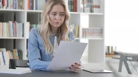 Woman Reading Contract, Documents in Office | Stock Footage - Videohive