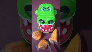 Crocodile Eating Orange Icing Candy 