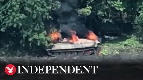 Russian soldiers flee after tank struck by Ukrainian drone