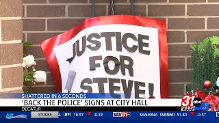 Signs supporting Steve Perkins, Decatur Police draw attention at City Hall
