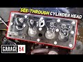 We watch an engine run through a transparent cylinder head