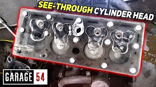 We watch an engine run through a transparent cylinder head