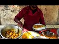 Young man hard warking for family at Kolkata street food stall