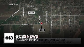 Grass fire prompts evacuations in Wilton area