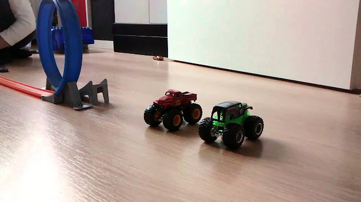 Hot wheels slow motion jump over monster trucks
