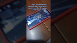 Toque fantasma do meu telefone começa a reagir com as configurações do jogo e a arma dispara sozinha