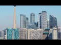 Toronto skyline revealing modern skyscrapers, famous landmarks, and waterfront on bright sunny day