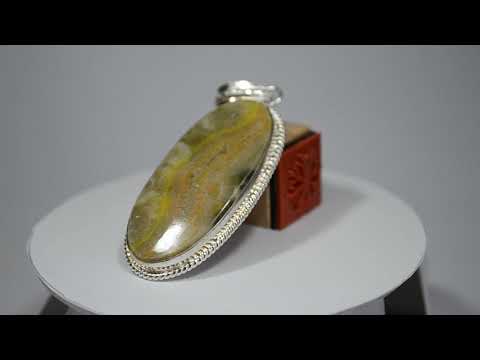 ასტროლოგიური ქვა იასპი ოვალურ ჩარჩოში