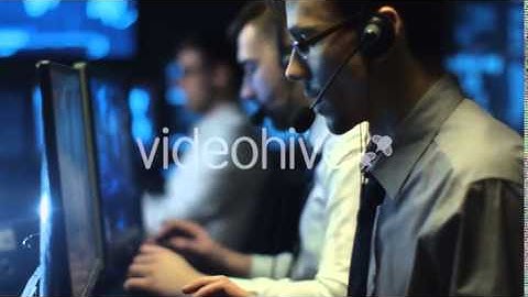 IT Programmers Working on Computer in Headset in Dark Office Room filled with Displays|Stock Footage