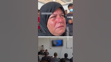 Palestinian mother tries to identify son from images of returned bodies
