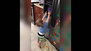 Boy gets cup of water from fridge filter but its spills on his face and he slips