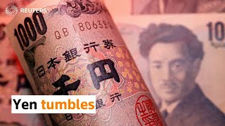 Yen tumbles as Bank of Japan holds firm on rates
