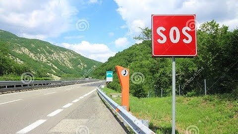Emergency SOS Phone Sign and Phone Box on Highway... police station