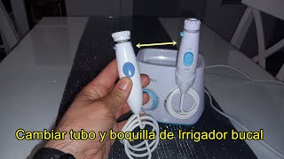 Cambiar ,sustituir goma o manguera de boquilla de irrigador bucal o dental.