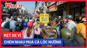 Kẹt xe vì chen nhau mua cá lóc nướng ngày vía Thần Tài - PLO