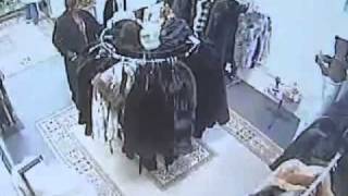Caught On Tape. Woman Caught On Camera Shoving Fur Coats Down Her Pants!