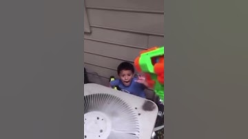 little kid gets shot by nerf gun in slow motion