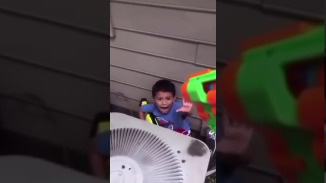 little kid gets shot by nerf gun in slow motion