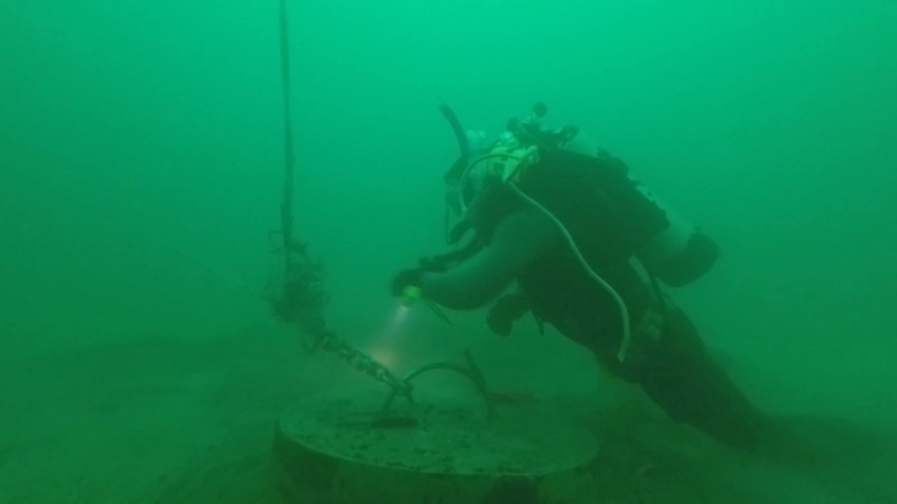 Prof. Cary Troy cutting line from Michigan City buoy anchor