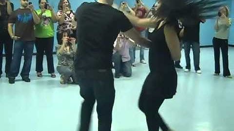 Denise Silva & Nick Haspil of Cache Studios salsa dancing on2