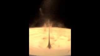 Underground cavity collapse: crater and  jet formation.