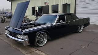 1965 Lincoln Continental build by Metalworks on air ride. Custom suicide slab restoration.